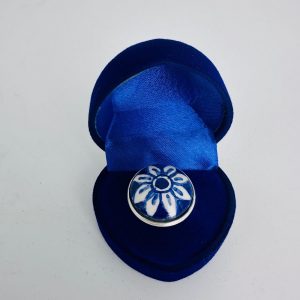 Round ring with dark flower design