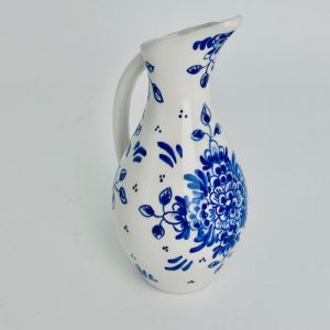 Vase with handle and traditional flowers