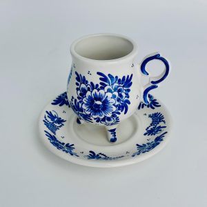 Cup and saucer with traditional flowers